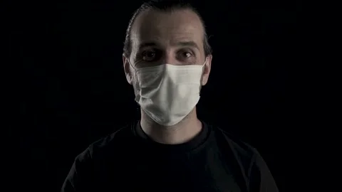 Young handsome man is approving face mask with hand gestures and smiling. Hap Stock Footage 133882843