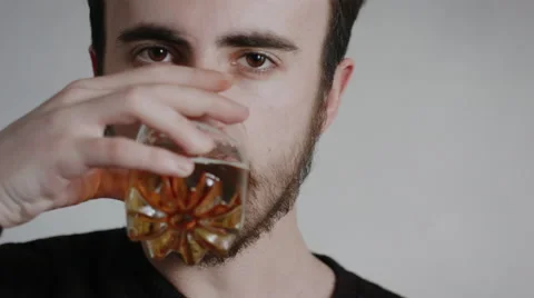 A Young Handsome Man With A Beard Drinking From A Glass With Pleasure Stock Footage 61832906