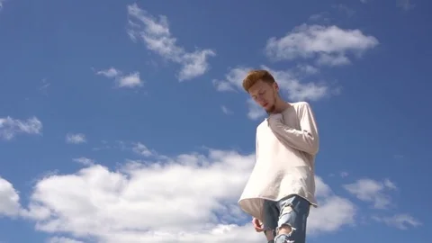 Young handsome man with beard poses to camera - Stock Footage 76449448