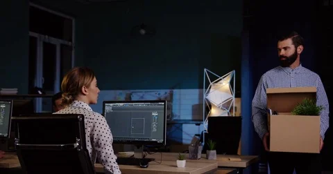 Young handsome man with a beard walking out from the office room late at night Stock Footage 82447053