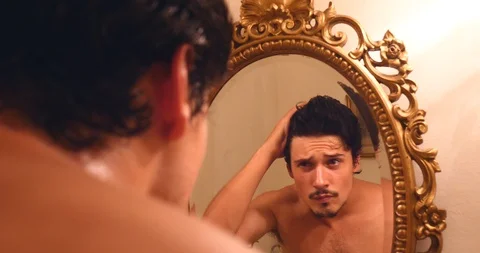 Young handsome man brushing his hair confident sucessfull Stock Footage 120215679