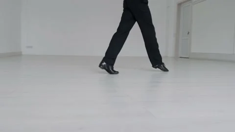 Young handsome man dancing ballroom dancing. A professional ballroom dancer trai Stock Footage 144336712