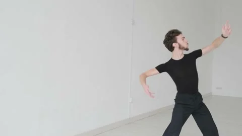 Young handsome man dancing ballroom dancing. A professional ballroom dancer trai Stock Footage 144336819