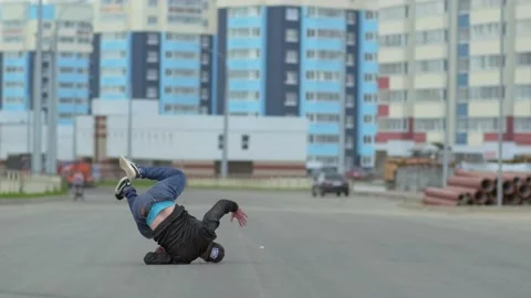 Young handsome man dancing hip hop outdoors in the city. Slow motion Stock Footage 138808628