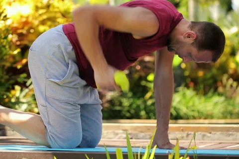 Young handsome man doing exercise with dumbbell NTSC Stock Footage 39969886