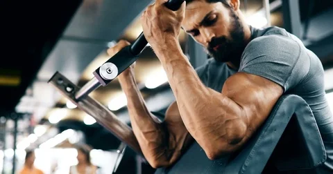 Young handsome man doing exercises in gym Stock Footage 81439112