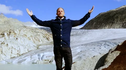Young handsome man doing recreational activity. arms raised. hiker background Видео 42911655