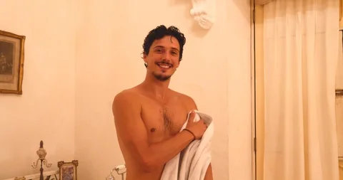 Young Handsome Man drying with towel after Bath In luxury bathroom Stock Footage 120215327