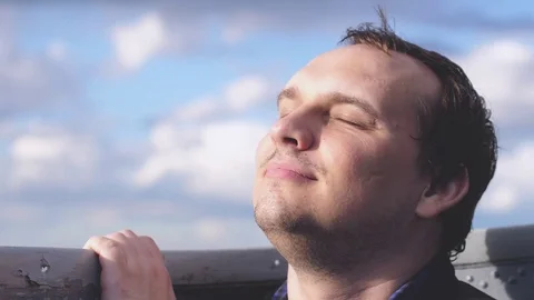Young handsome man enjoying on voyage around world on luxury cruise ship in slow Stock Footage