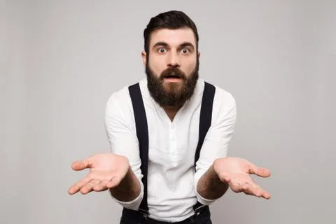 Young handsome man gesturing over white background Stock-Fotos