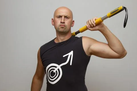 Young handsome man with gymnastic stick Stock Photos