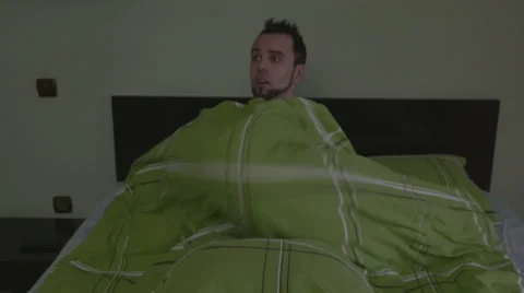 Young handsome man having a nightmare and going back to sleep Stock Footage 59842556