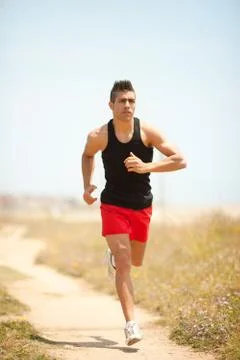 Young handsome man jogging Stock Photos