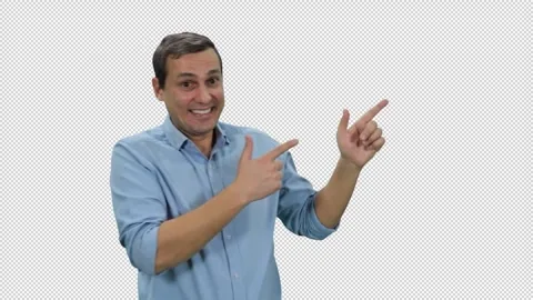 Young handsome man in light blue shirt pointing his fingers at something, alpha Video stock 272929569