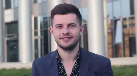 Young, Handsome Man Looking at The Camera And smiling. Businessman winking. Stock-Footage 54685000