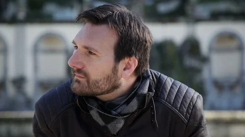 A young, handsome man looks into a camera with a smile  Vidéo 102281787
