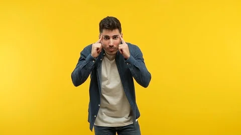 Young handsome man making a concentration gesture Stock Footage 97699164
