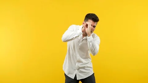 Young handsome man making the gesture of a spyglass Stock Footage 97657737