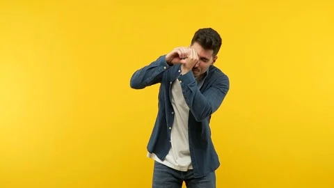Young handsome man making the gesture of a spyglass Stock Footage 97699050