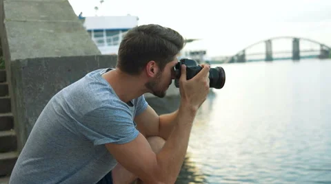 Young handsome man making pictures Stock Footage 68599013