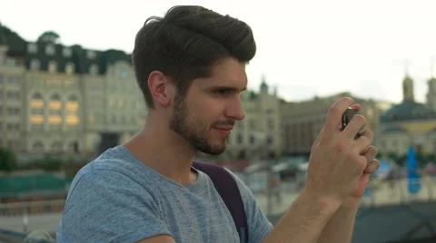 Young handsome man making pictures Stock Footage 68599547