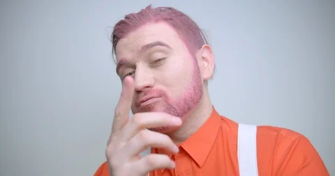 The young handsome man with pink beard and hair is sending air kisses, smiling Stock Footage 87982723