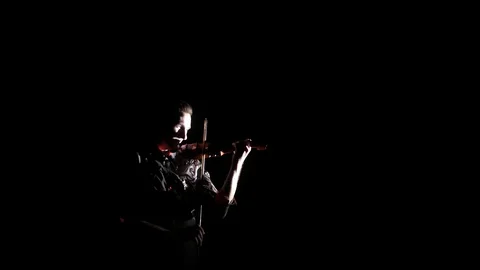 Young handsome man plays electric violin on black background, isolated Stock-Footage 107871712