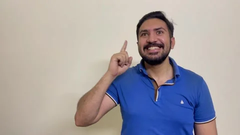  young handsome man point index finger up on something gesture isolated on white Stock Footage 241446359