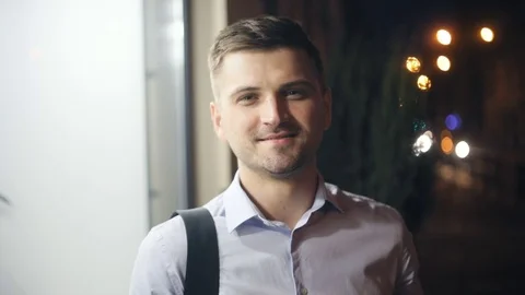 Young handsome man pointing finger camera white shirt portrait closeup focused Stock Footage