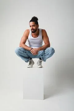 Young handsome man posing in the studio. Mind set and mental health. Photos
