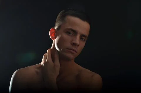 Young handsome man posing in the studio. Stock Photos