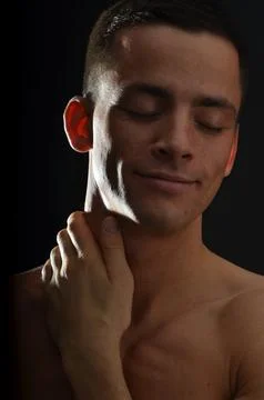 Young handsome man posing in the studio. Stock-Fotos