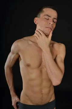 Young handsome man posing in the studio. Stock Photos