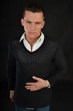 Young handsome man posing in the studio. Stock Photos