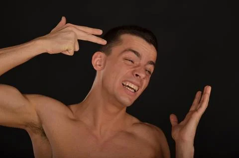 Young handsome man posing in the studio. Stock Photos