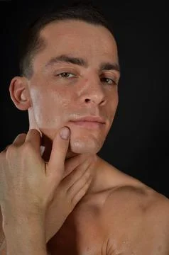 Young handsome man posing in the studio. Stock Photos
