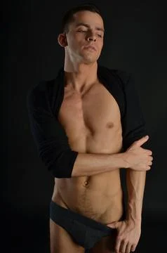 Young handsome man posing in the studio. Stock Photos