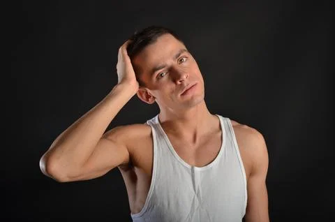 Young handsome man posing in the studio. Stock Photos