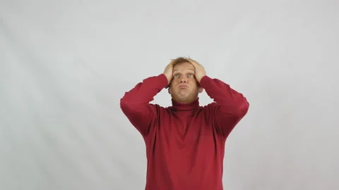 Young handsome man in red sweater posing for the camera Stock Footage 103870445