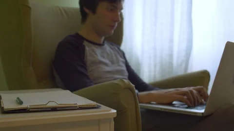 Young handsome man on remote job Stock Footage 130970593