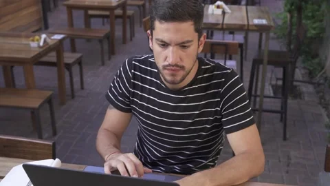 Young handsome man remote working in bar with computer Stock-Footage 153107091