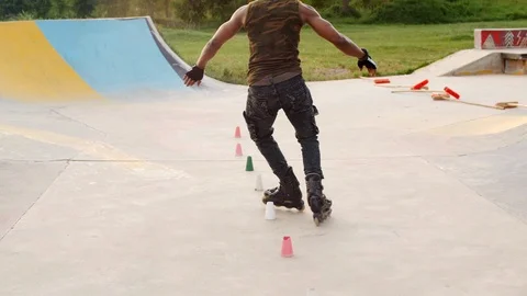 Young handsome man rollerblading in a park.4k Clip. Stock Footage 110824422