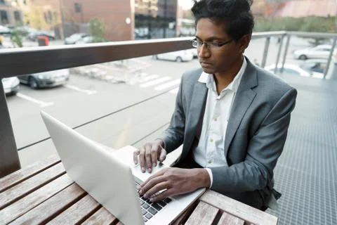 Young handsome man is sitting at the table Foto stock