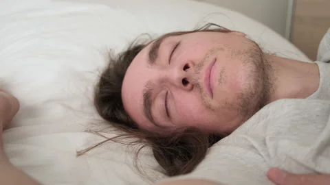 Young handsome man sleeping Video stock 198742678