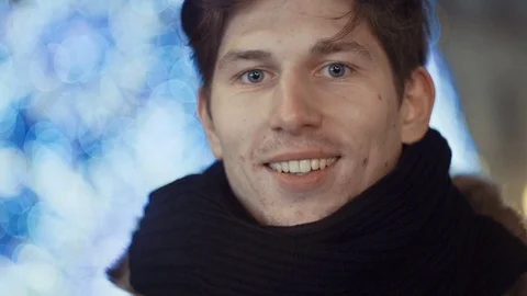 Young handsome man smiling over bokeh background. Stock Footage 71222147