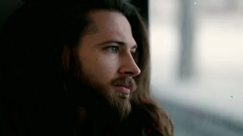 Young handsome man in train, looking at window, close up portrait, pensive guy Stock Footage 172342170
