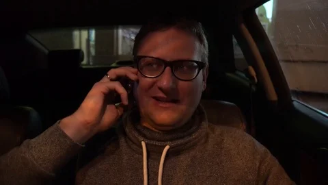 Young handsome man using mobile phone in the car Stock Footage 89258213