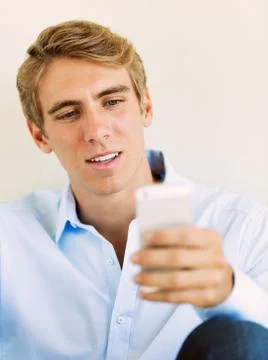 Young handsome man using smart mobile phone, Stock Photos
