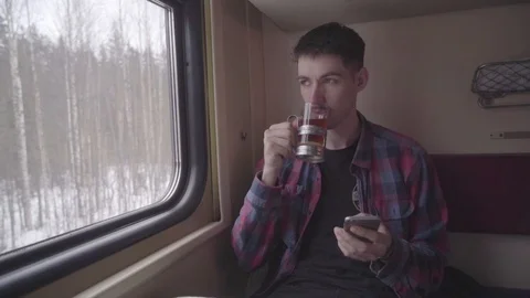 Young handsome man using the smartphone with touchscreen in subway. Stylish male Video stock 102761129