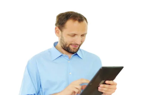 Young handsome man using tablet computer, isolated on white NTSC Stock Footage 37343781